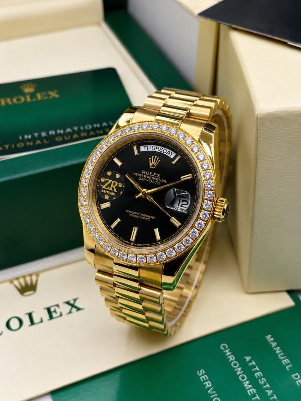 Yellow gold day date Rolex stoned watch